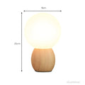 lumiorb-nachttischlampe-holzfuß-rund-design-led-beleuchtung-warmes-licht-xlumina